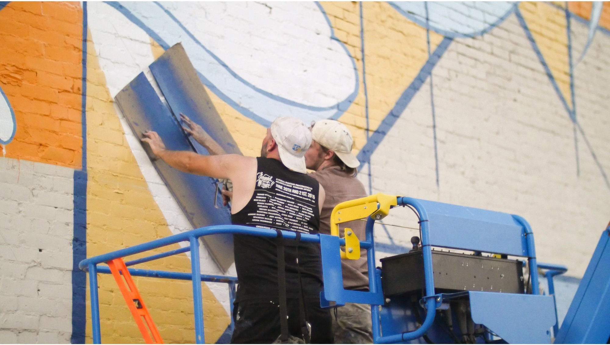 Homecoming — scale view of Adam Stephenson's 40×70 ft mural in downtown Decatur, Alabama (2019) showing the full building elevation