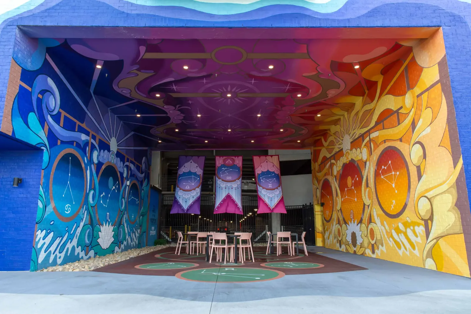 The Hall of the Magician from the mouth of the breezeway, the wave-shaped blue border framing the finished room