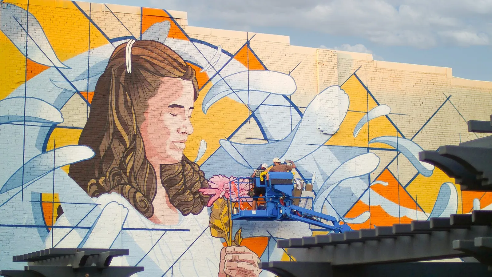 Homecoming mural, Decatur, AL, artist at work